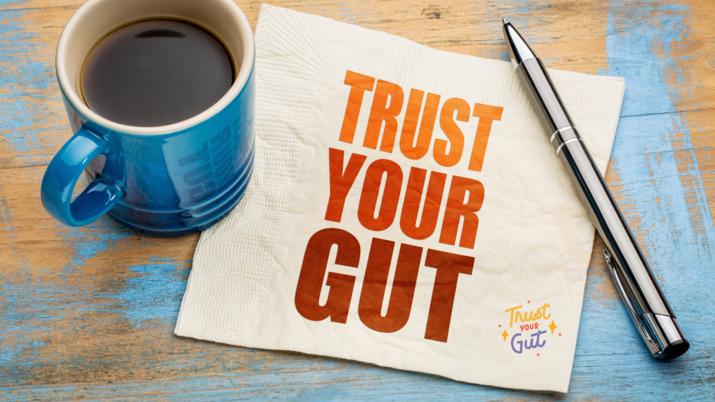 coffee cup on tissue with quote trust your gut – gut health motivation.